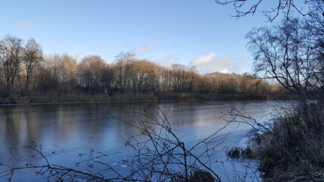 Venta river is still frozen even in the middle of the day